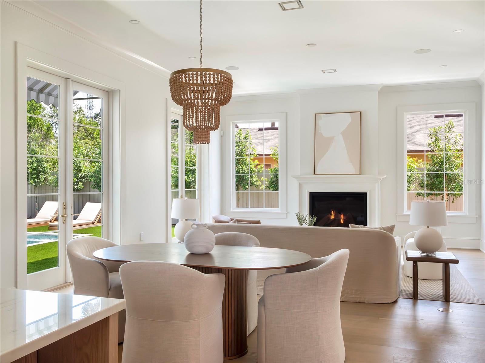 Living and dining with pool view